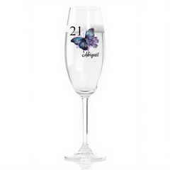 A clear glass with a butterfly design and the number 21 printed on it.