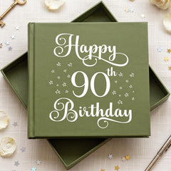 A green box with the text "Happy 90th Birthday" written on it, surrounded by scattered gold stars and a key.