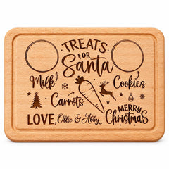 The image is a wooden cutting board with a personalized message engraved on it. The message reads "TREATS for Santa" and includes various Christmas-themed items such as a snowflake, a carrot, a reindeer, and a Christmas tree. The cutting board is made of wood and has a natural finish.