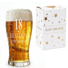 A glass of beer with the number 18 and the text "BRANDON" and "HAPPY BIRTHDAY" printed on it, next to a white box with gold stars and the text "UK GIFT STORE ONLINE".