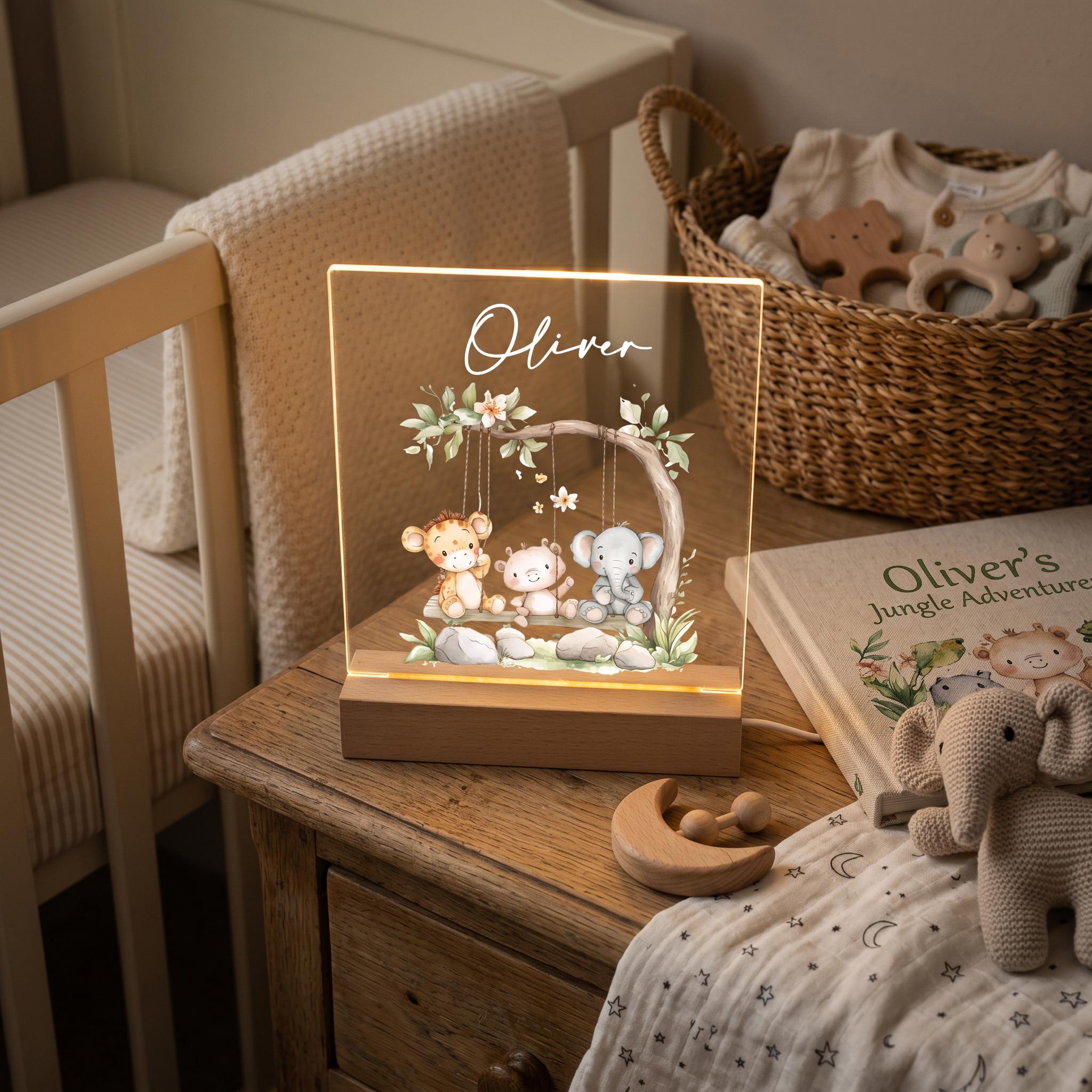 A wooden nightstand with a lighted picture frame containing a picture of a baby elephant, a baby giraffe, and a baby monkey, along with a wooden rocking horse and a wooden toy elephant. The nightstand is situated next to a basket filled with baby toys.