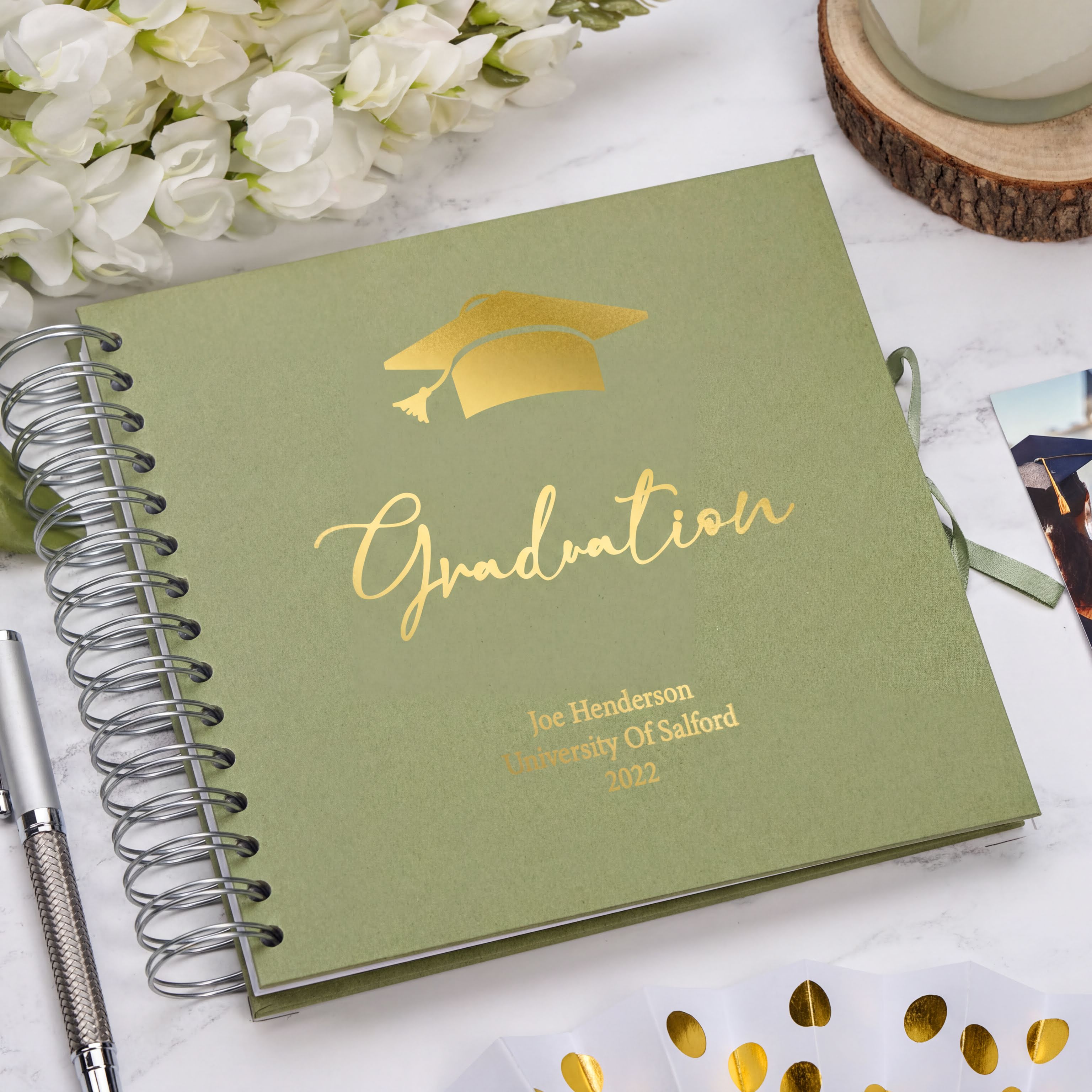 a book with a graduation cap on top of it