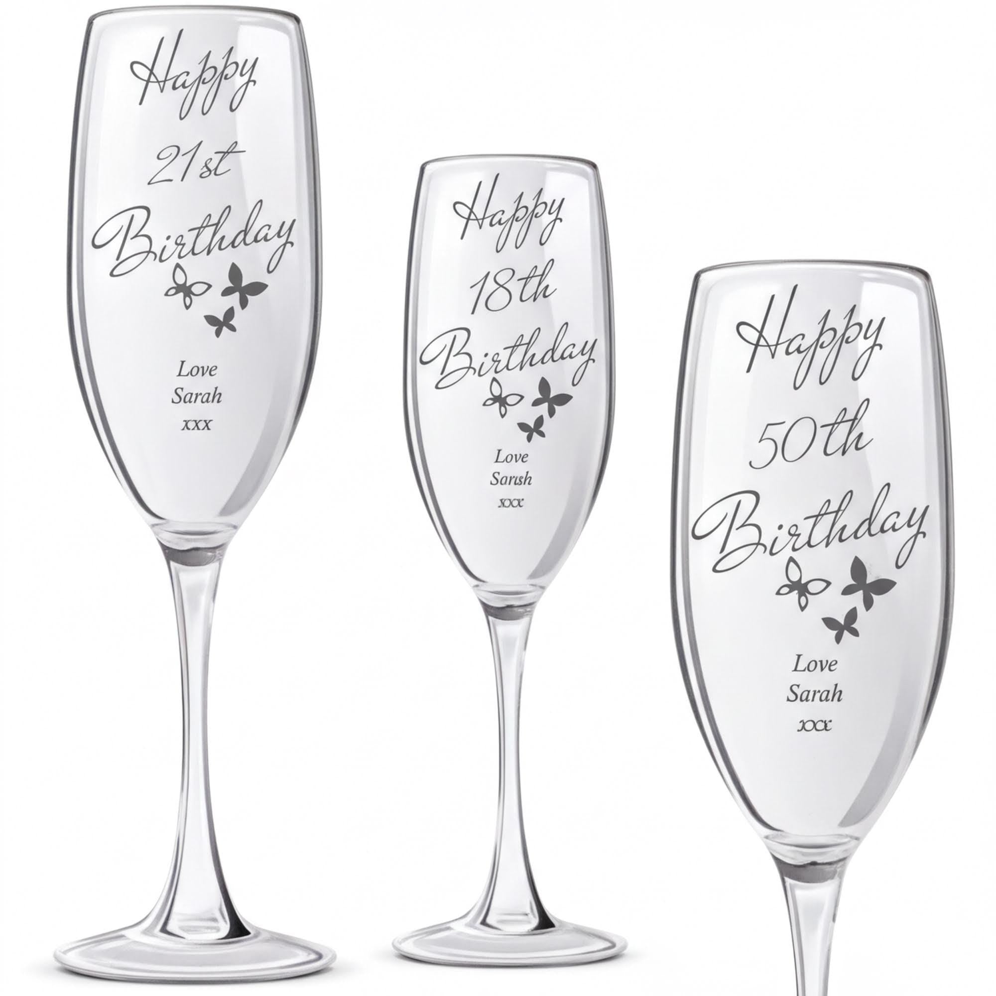 three personalized birthday glasses, each with a unique message and name engraved on them.