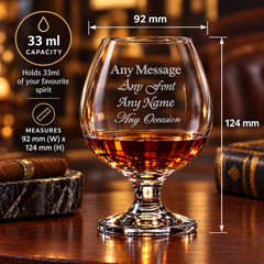 A personalized glass of whiskey with the text "Any Message Any Font Any Name Any Occasion" engraved on it, along with measurements and a capacity of 33 milliliters.
