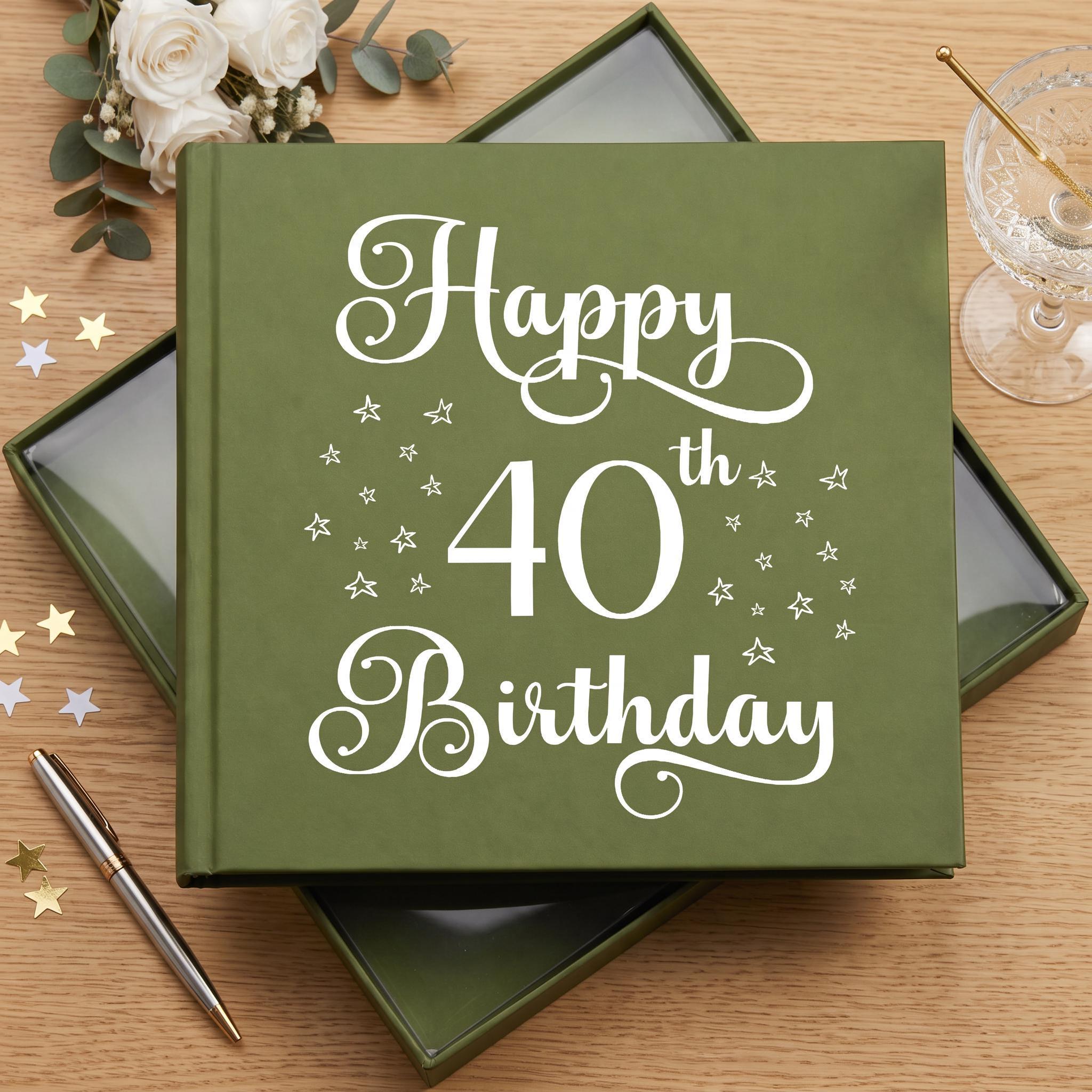 A green photo album with the text "Happy 40th Birthday" printed on it, surrounded by white stars and a glass of wine.