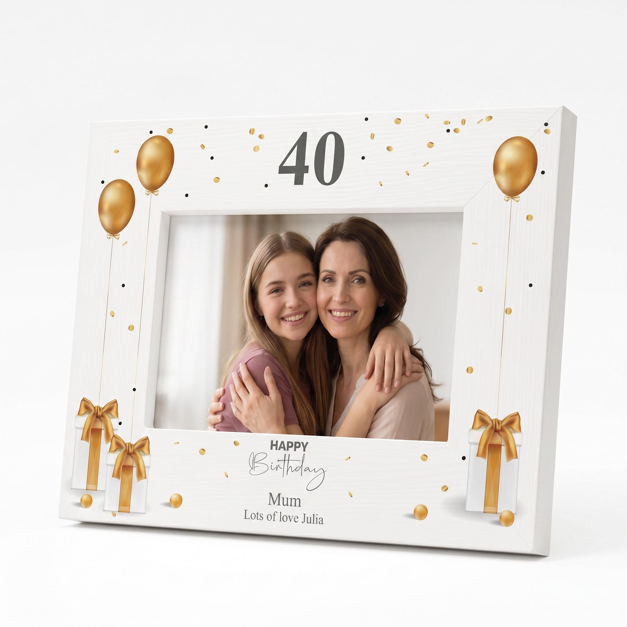 A white picture frame with a design of gold balloons and presents, along with the text "Happy Birthday" and " Mum Lots of love Julia" printed on it.