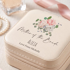 A beige jewelry case with a floral design and personalized text, including the name "Mother of the Bride" and the name "Love From Michelle".