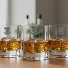 Three glasses of whiskey with a brand logo on a wooden surface