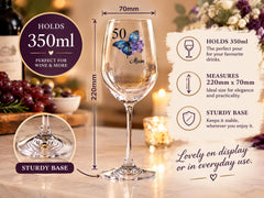 The image is a detailed description of a wine glass, including its size, design, and features. It is a 250ml glass with a sturdy base, suitable for wine and more. The glass has a butterfly design and is suitable for a 50th birthday celebration. The image also includes a photo of the glass on a table with wine bottles and grapes, as well as a description of the glass's features and measurements.