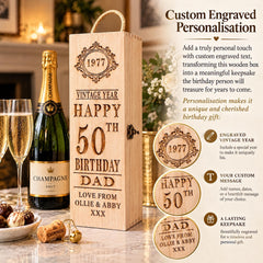 a wooden box with a personalized message engraved on it, along with a bottle of champagne and glasses, suggesting a celebration or special occasion.