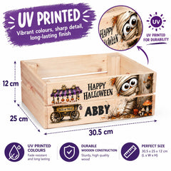 The image is an advertisement for a wooden crate with a Halloween theme. It features a wooden crate with a carved design and a carved face, along with a carved face and a carved pumpkin. The crate is described as UV printed, which means it has a durable finish and is water-resistant. The dimensions of the crate are 12 cm by 25 cm, and it is made of high-quality wood. The crate is also described as perfect in size, with a maximum length of 30.5 cm and a width of 25 cm.