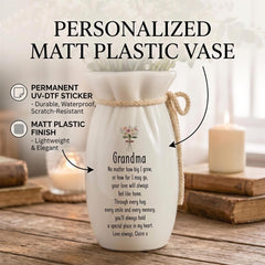 a personalized white ceramic vase with a floral design, placed on a wooden surface. The vase has a message written on it, and there are some text boxes next to it providing information about the vase.