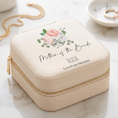 A beige jewelry case with a floral design and text that says "Mother of the Bride" and "Love From Michelle" printed on it.