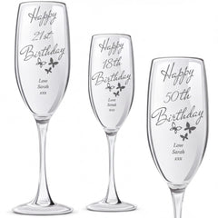 three personalized birthday glasses, each with a unique message and name engraved on them.