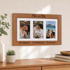 a wooden frame with three photographs arranged in a collage, depicting a couple and two other individuals. The frame has a decorative border and the text "Mrs and Mrs" is written above the photographs.