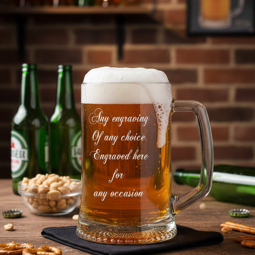 Engraved beer mug with beer bottles and snacks on a wooden table.