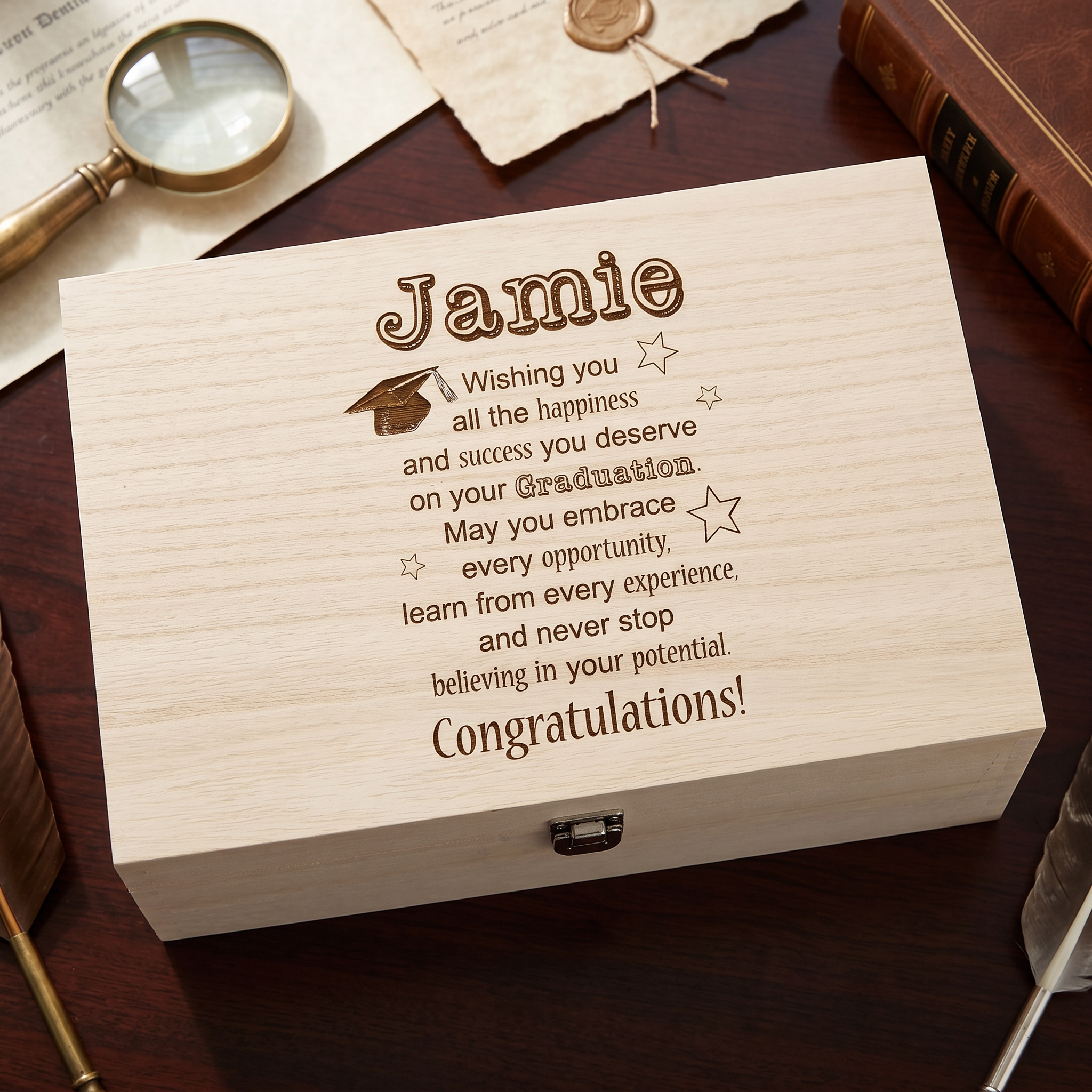A wooden box with a personalized message engraved on it, placed on a wooden surface.
